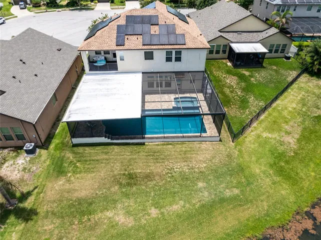 Aerial view of home and spacious backyard.