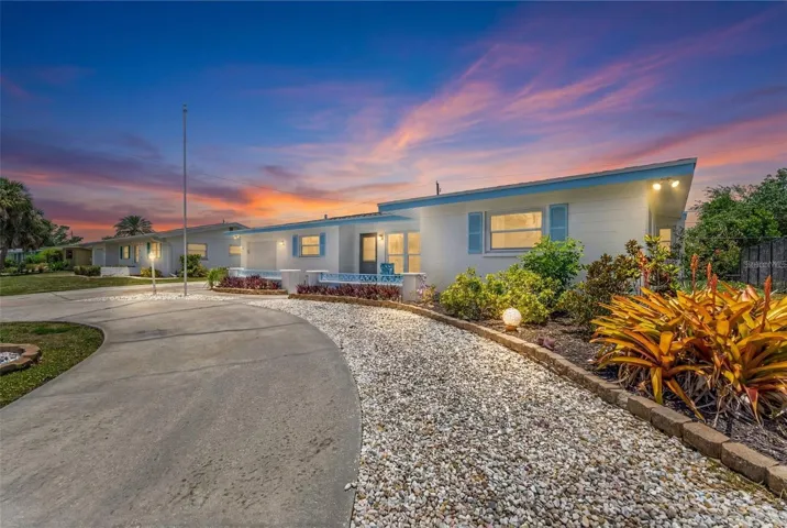 Front of home with enhanced lighting