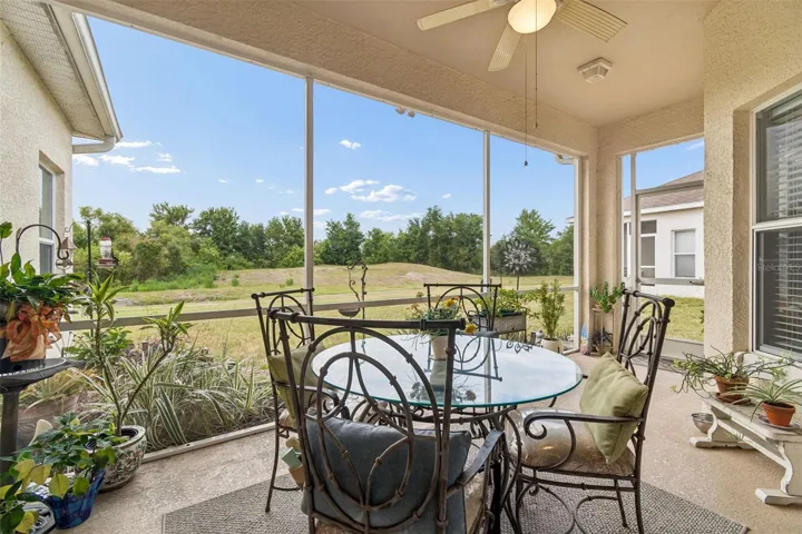 Large screen porch with conservation view and ceiling fan to keep you cool