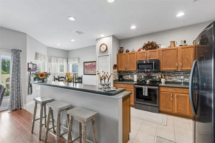 Kitchen with tile flooring and stainless appliances