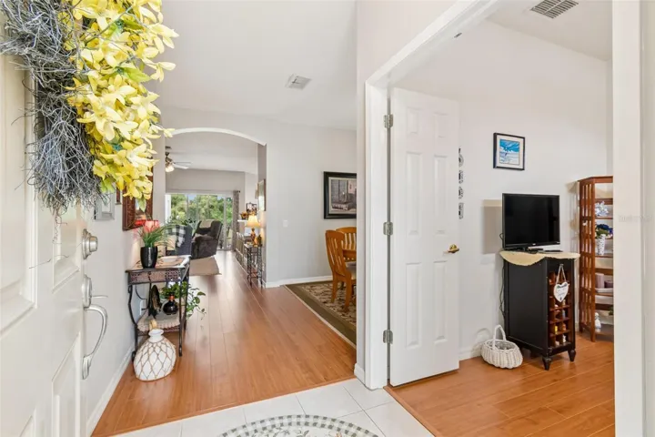 Foyer looking to office/den/guest room and dining room