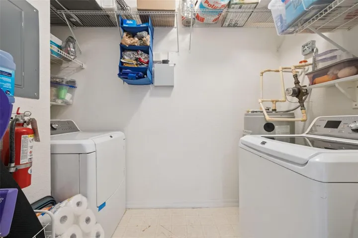Laundry room off the kitchen with extra storage