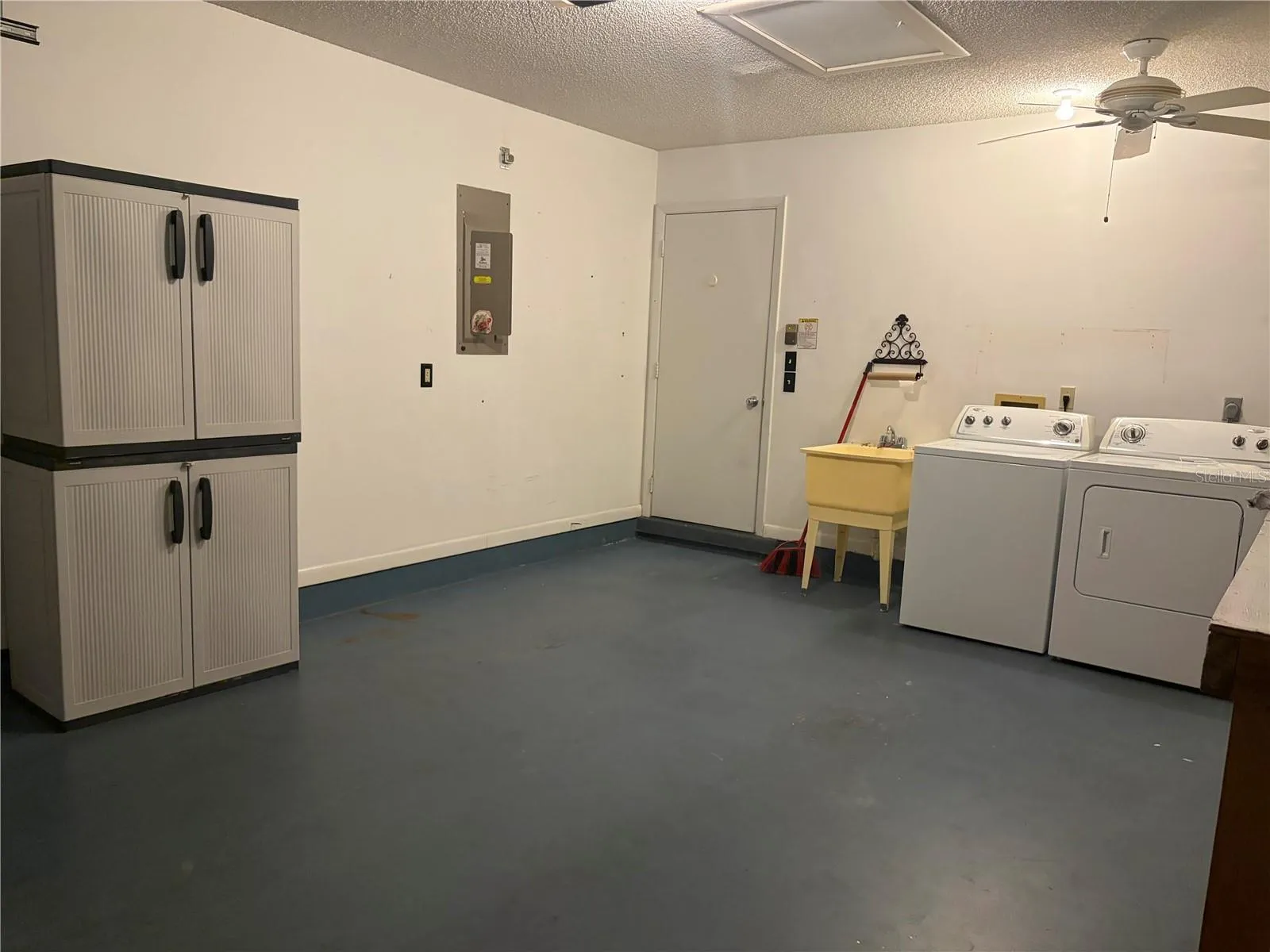 garage with washer and dryer and storage