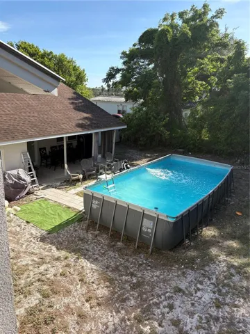 BACK OF HOME AND POOL