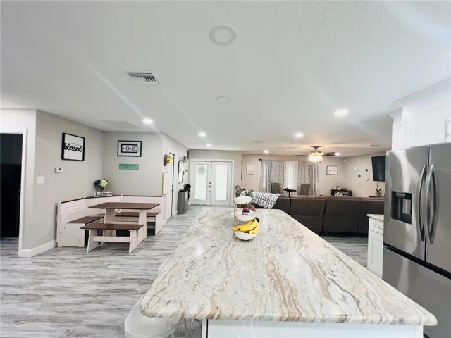 VIEW LOOKING OUT TO DINING AND LIVING AREA