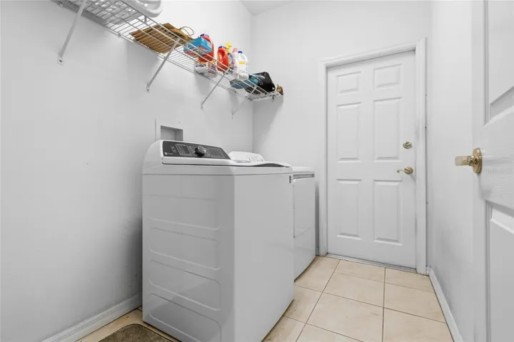 LAUNDRY ROOM WITH DOOR TO GARAGE