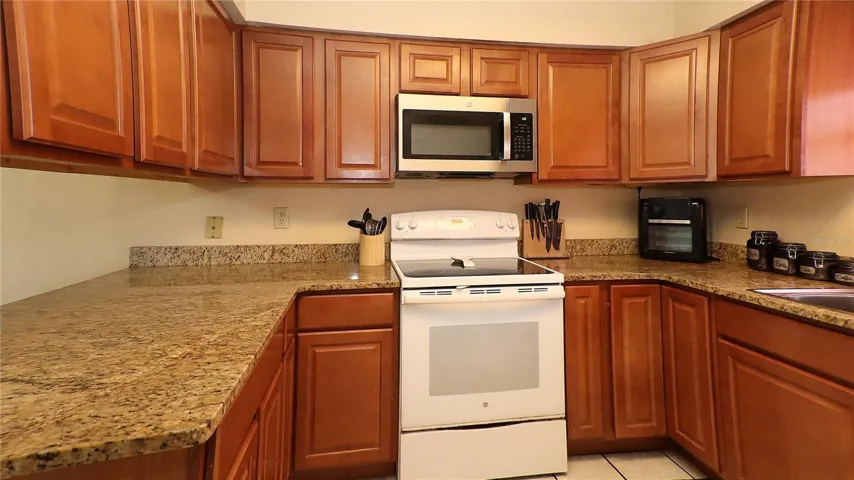 kitchen features abundant wood cabinets...