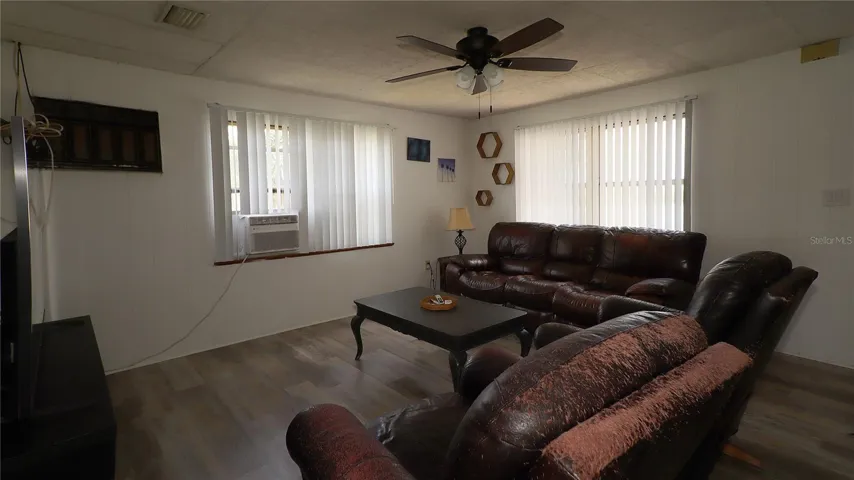 with LVP flooring and ceiling fan...