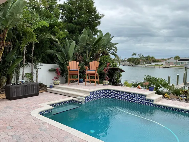 Saltwater heated pool with attractive pavered area with many well-planned areas to sit & relax