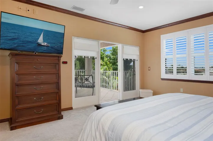 Master bedroom has French doors leading to 2nd floor balcony overlooking the back yard retreat