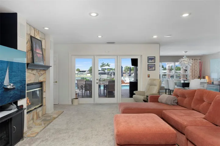 Spacious main living area with French doors leading to the outside paradise