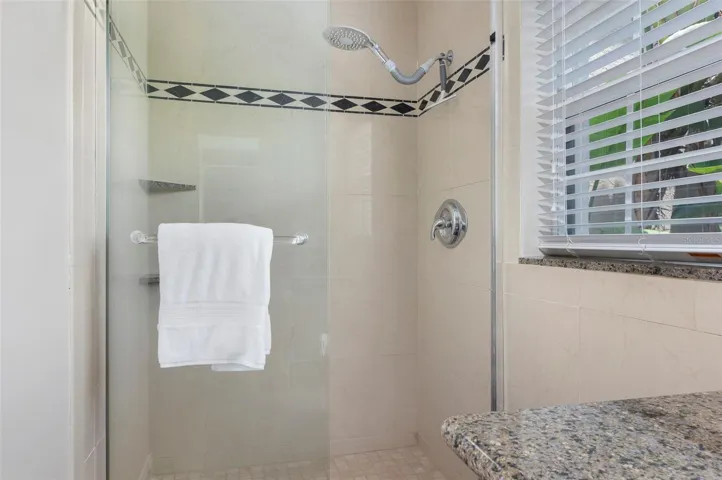 Walk-in shower in full bath off family/game room