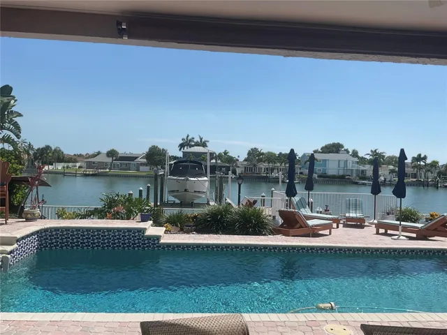View of pool from covered dining area