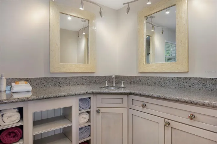 Full bath off family/game room - pretty granite countertops and walk-in shower