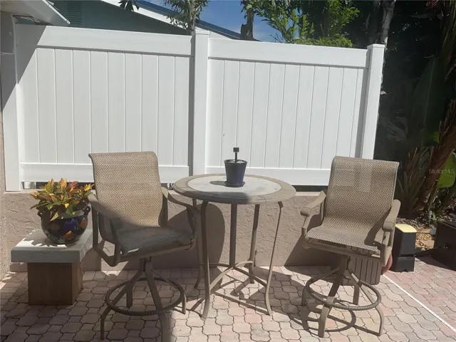 Another area to sit, relax and enjoy the pool and water view
