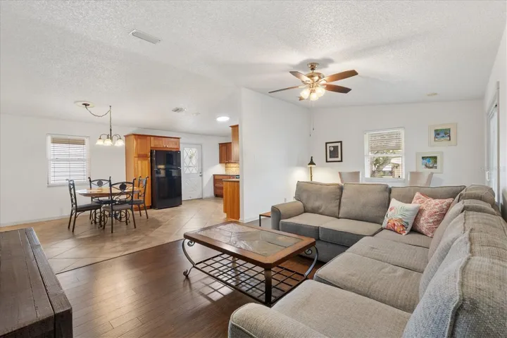 Living Room with view of Dining Room &amp; Kitchen