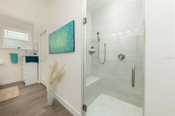 Primary Bathroom Shower with built-in seat