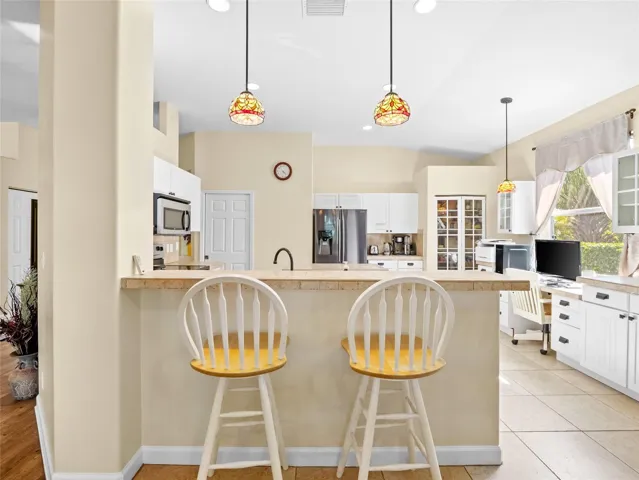 Well-designed kitchen with ample cabinetry and counter space