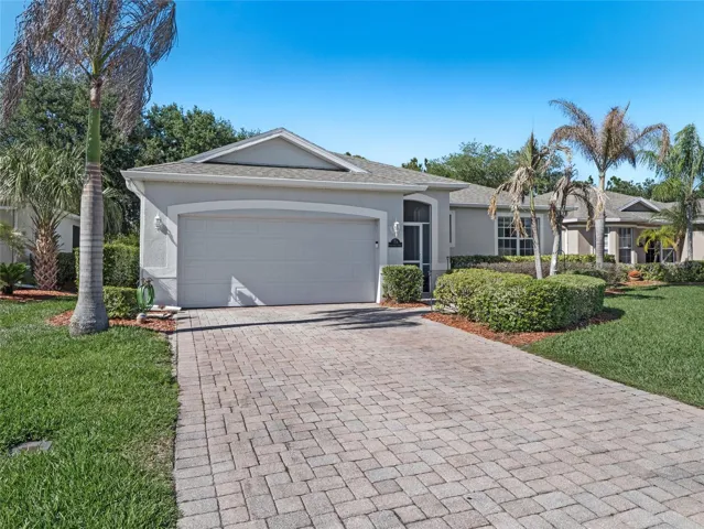 Spacious driveway leading to a well-maintained garage and entryway