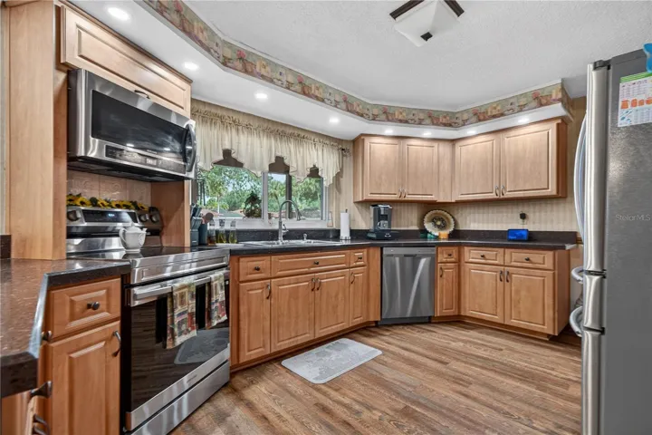 Kitchen with Stainless Steel Appliances and Granite Countertops.