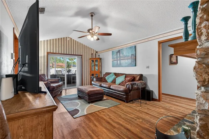 Family room with sliding door leading to enclosed porch