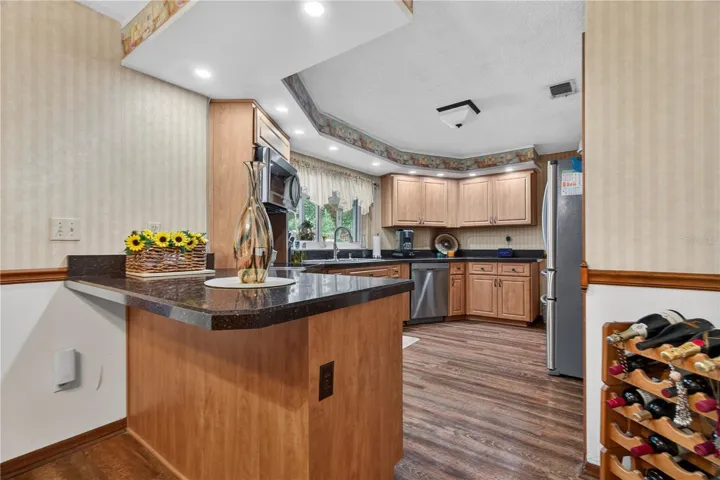 View of the Kitchen with Granite Countertops and stainless-Steel Appliances