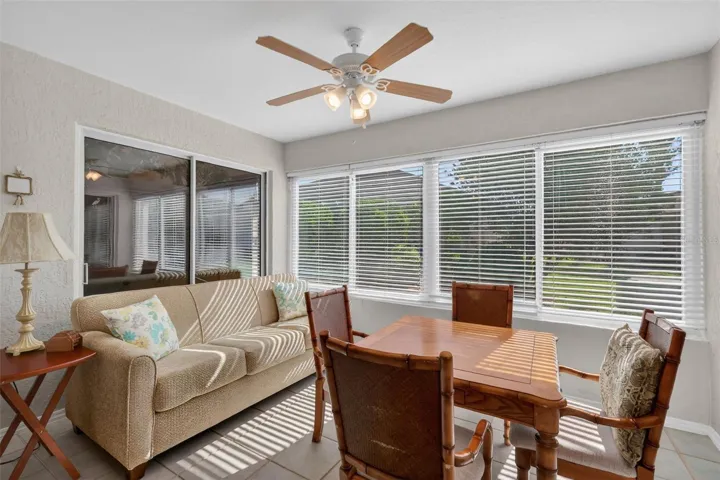 Florida Room with Sliders to Living Room, Primarty Bedroom and Kitchen eating area.
