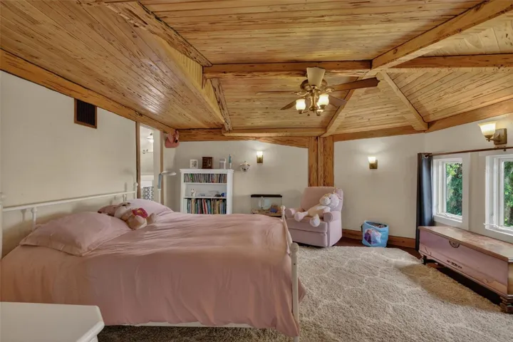 Bedroom 2 has beautiful cedar ceiling, and an en-suite 1/2 bath