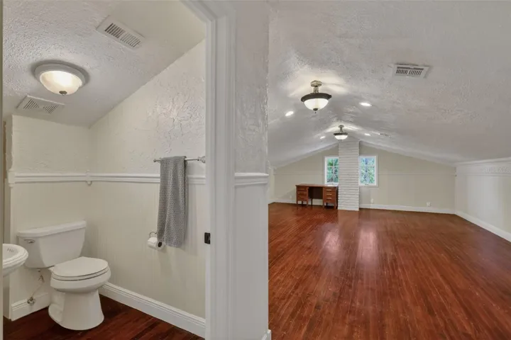 Third level; half bath and bonus/rec room
