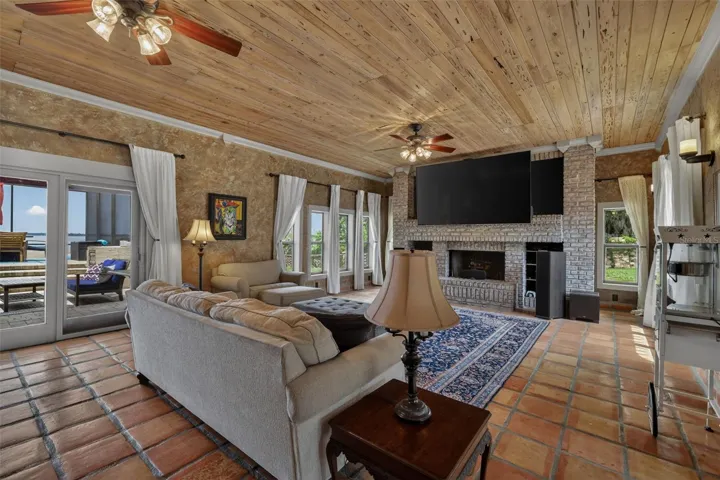 Family room, with stately fireplace and cedar ceiling