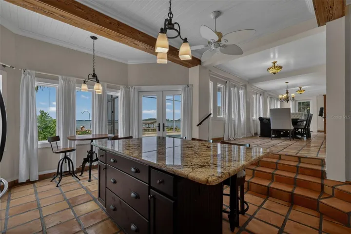 Kitchen also has view of the pool and Lake; dining room to the Right