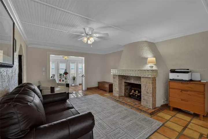 Living room with fireplace and entrance to the dining room