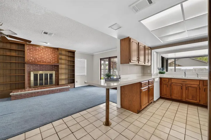 Kitchen seamlessly opens to family room.