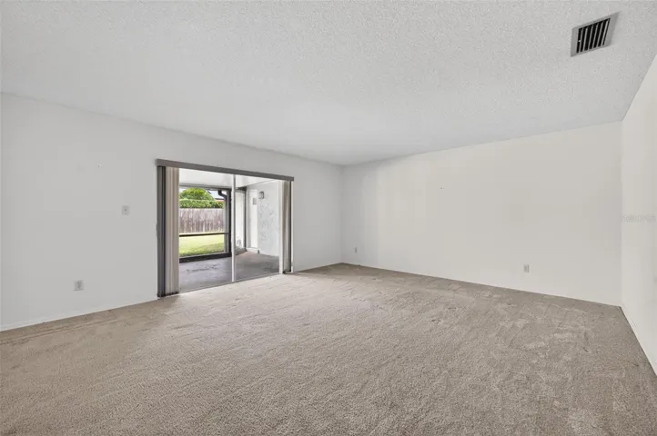 Formal Living Room w/ slider to large screened porch