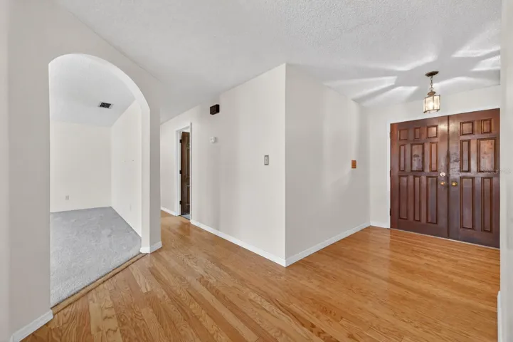 Foyer with double door entry & wood floors