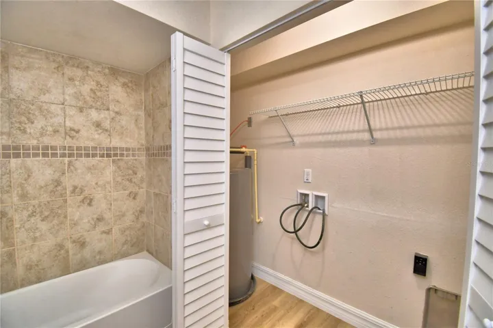 Utility closet for washer/dryer and hot water heater.