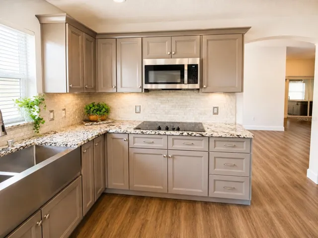 Kitchen with stove top and microwave