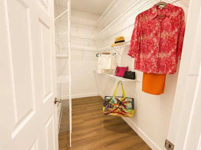 Walkin closet in primary bedroom