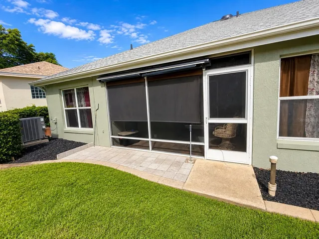 Back of house with enclosed porch