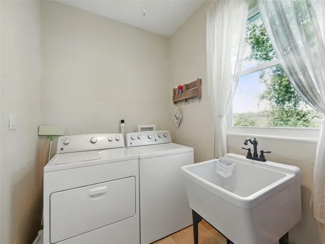 Laundry room with utility sink.