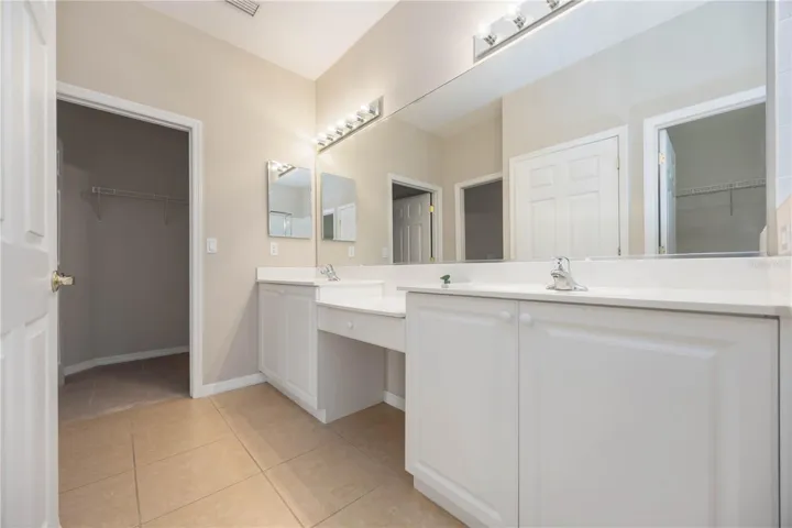Primary bathroom with access to walk-in closet