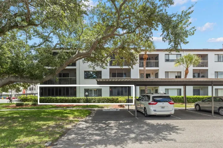 Rare 3-bedroom, 2-bath ground-floor corner condo in a secure, well-maintained community with covered parking and mature park-like landscaping.