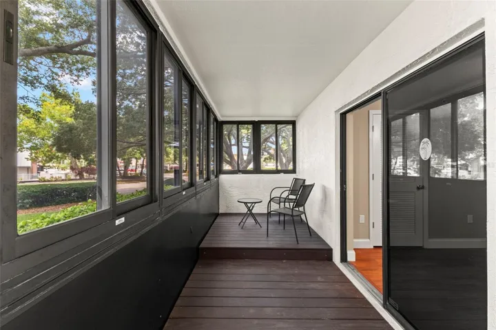 A private retreat with wall-to-wall windows, composite decking, and serene views of the beautifully maintained grounds.