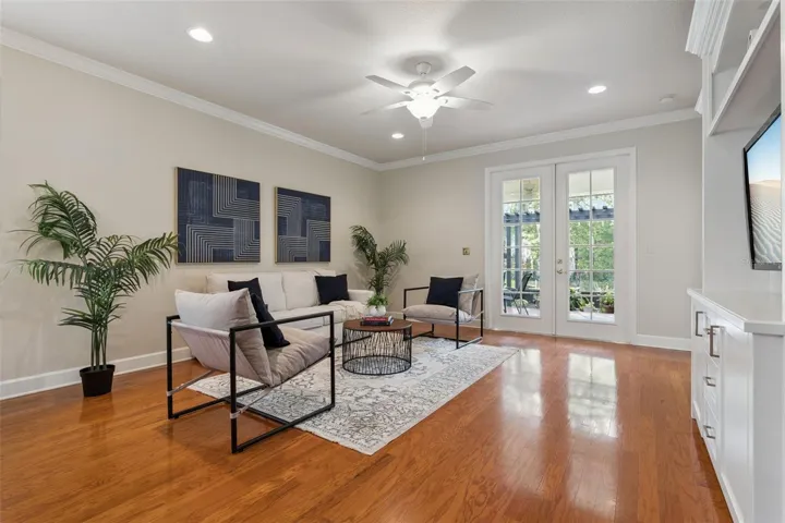Great Room w/ double French doors that lead to the screen enclosed covered lanai