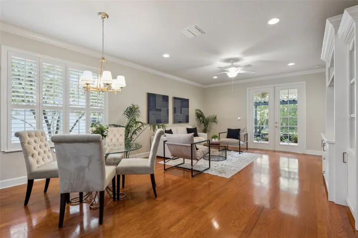 Dinette & the 16' x 16' Great Room area w/ recessed lighting, crown molding & a ceiling fan