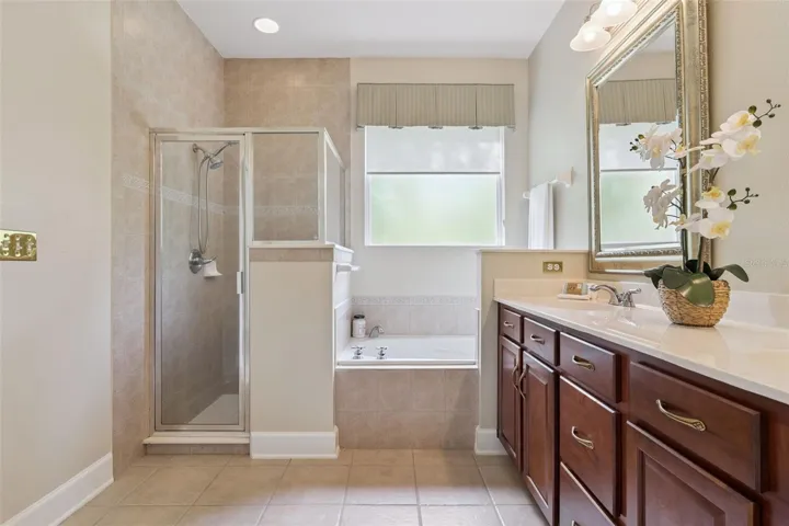 Primary Bathroom glass enclosed walk-in shower & soaking tub