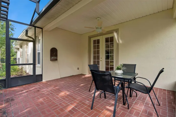 Screen enclosed covered Lanai w/ a ceiling fan