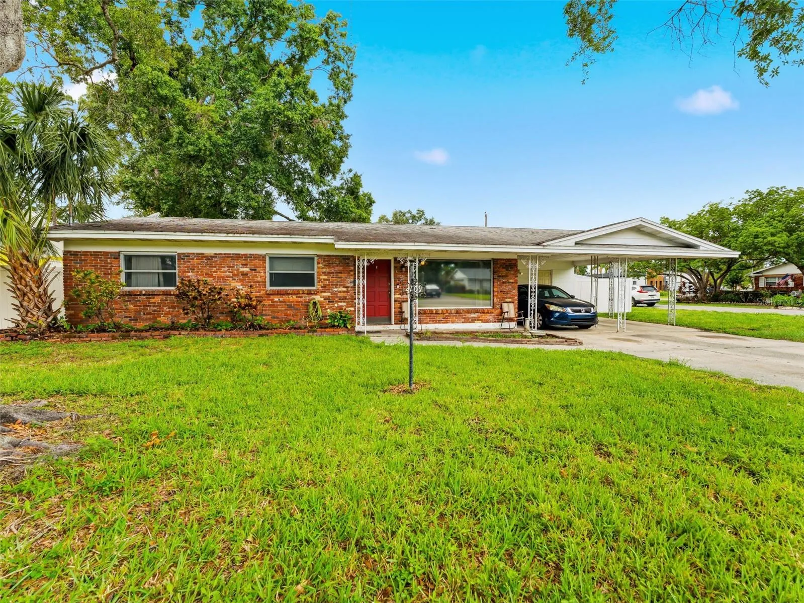 A one-car carport and cute porch give this home personality!