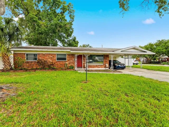 A one-car carport and cute porch give this home personality!
