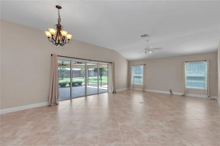 Open living room and sliders leading to the spacious lanai